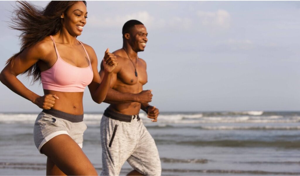couple-running-along-beach-smiling-2023-11-27-05-14-54-utc (1)